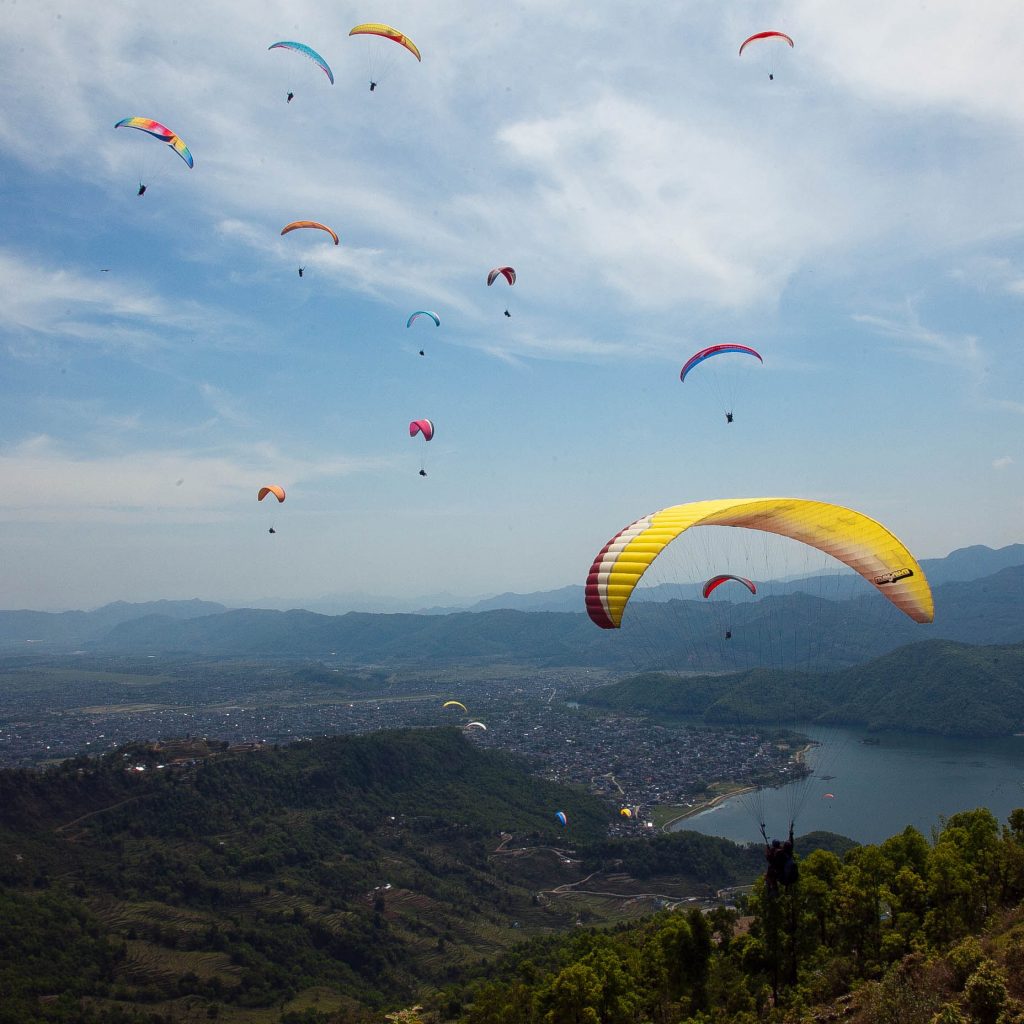 Domestic and abrod tourist enjoy paragliding flight in  Pokhara recently . Pokhara is famous touristic destination for paragliding. KANTIPUR PHOTO/ NARENDRA SHRESTHA / POST PHOTO